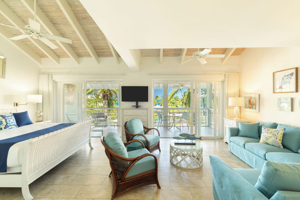 Junior Suite, Partial Ocean View | In-room safe, iron/ironing board, WiFi (free), bed sheets