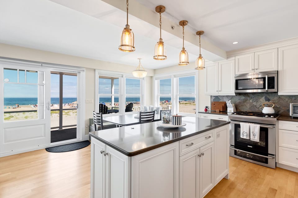 The beach is the yard! Prime location a 1 minute walk to downtown Hampton