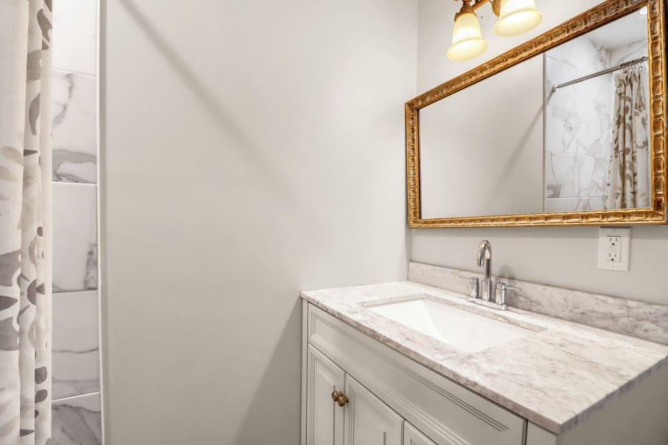 Bathroom 2 - attached to bedroom 4 features updated fixtures