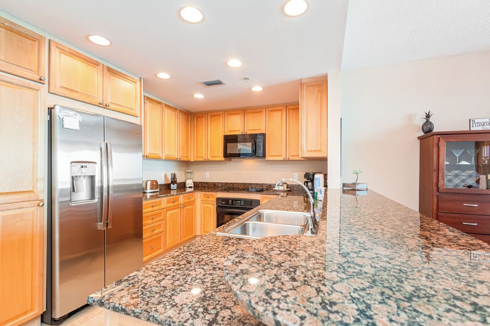 This well-appointed kitchen is ready for your culinary adventures, with granite counters, stainless appliances, and plenty of cabinet space to make meal prep a breeze.