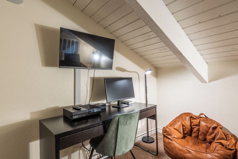 Functional workspace and second TV area for when the kids! 