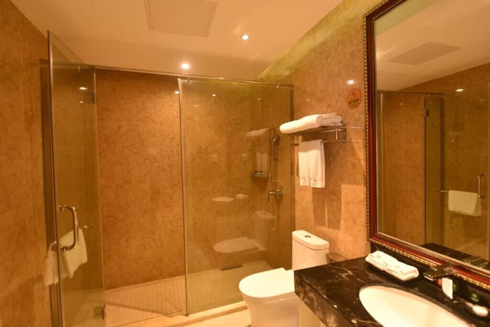 Standard Double Room Single Use, Garden View | Bathroom | Shower, hair dryer, slippers, towels