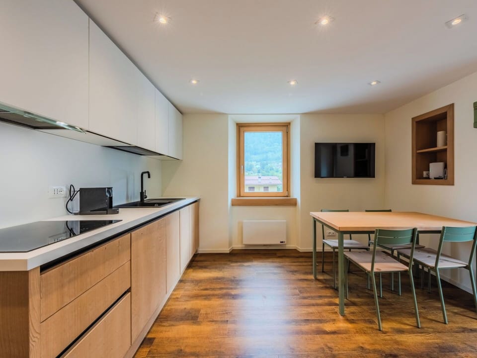 Flooring, Interior Design, Floor, Wood, Ceiling, Wood Flooring, Room, Cabinetry, Furniture, Lighting