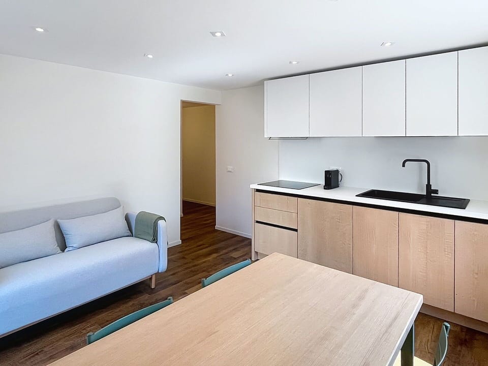 Furniture, Interior Design, Flooring, Floor, Wood, Countertop, Ceiling, Kitchen, Cabinetry, Room