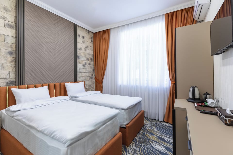 Deluxe Double or Twin Room, City View | Hypo-allergenic bedding available, minibar, in-room safe, desk