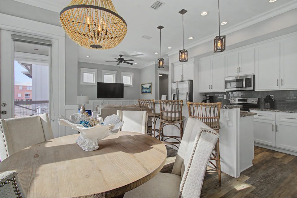 Charming dining area welcomes you to savor meals while chatter flows and coastal breezes drift in