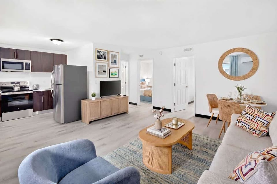 Settle into the comfortable living room, featuring cozy seating and a Smart TV for relaxing after a day out.