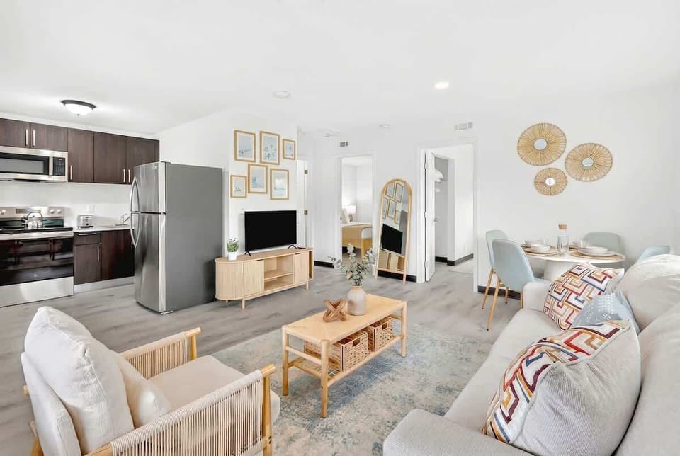 Settle into the bright living room with comfortable seating and a Smart TV for relaxing evenings.