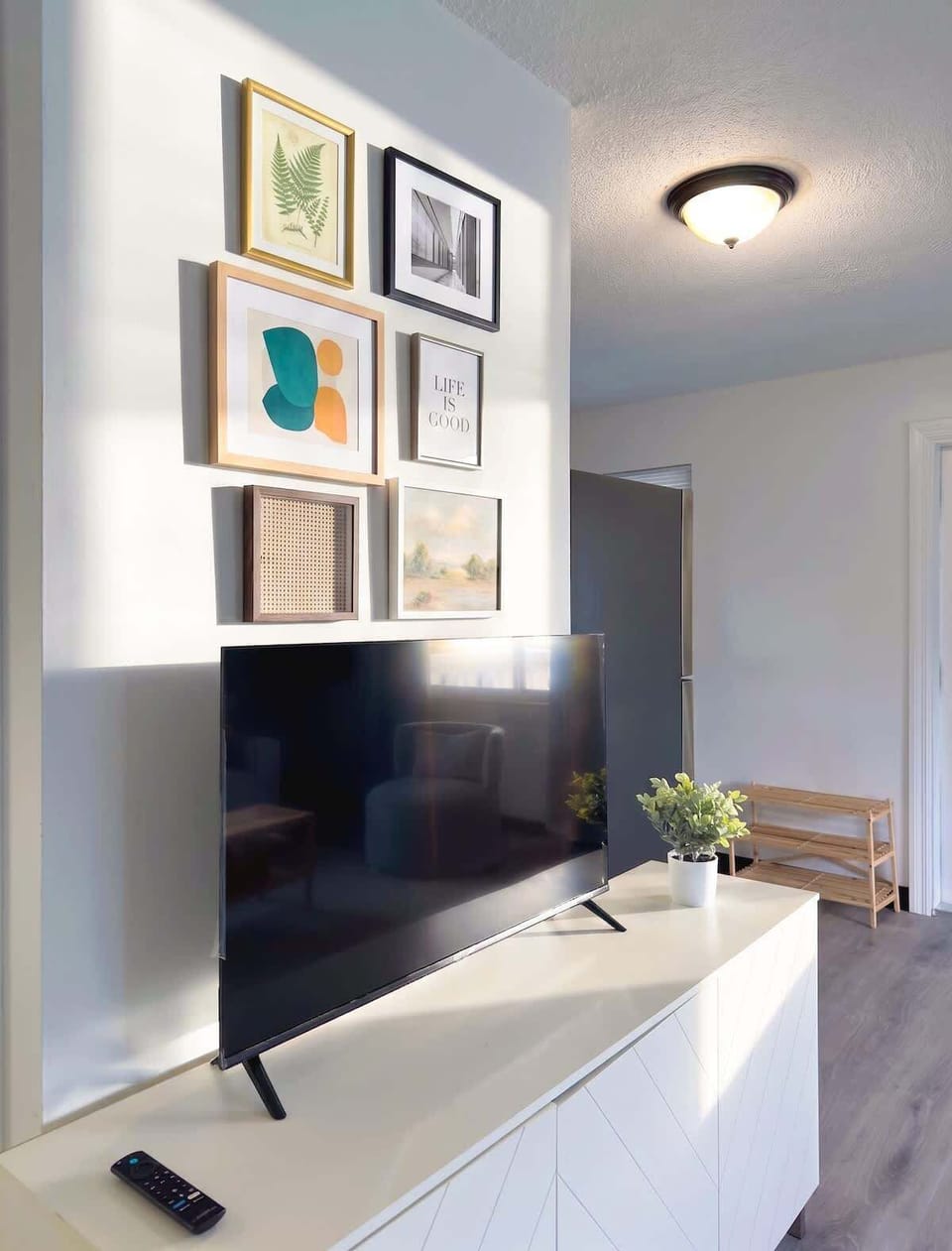 Unwind in the bright living room with comfortable seating and a Smart TV for your entertainment.