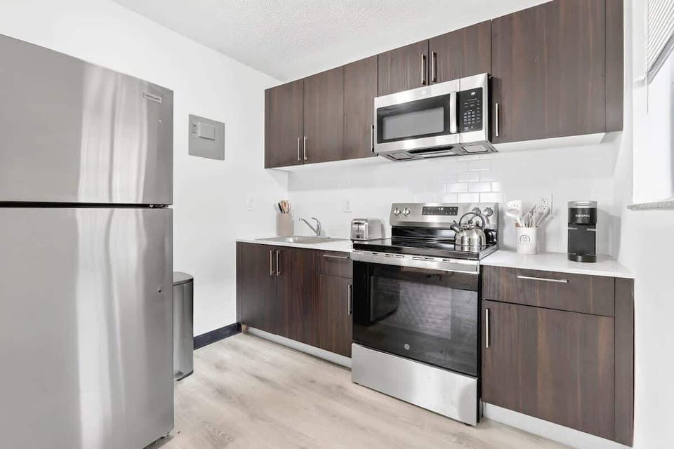 Prepare delicious meals with ease in the fully equipped kitchen featuring all the everyday essentials.
