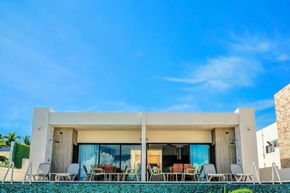 Villa exterior with shared pool