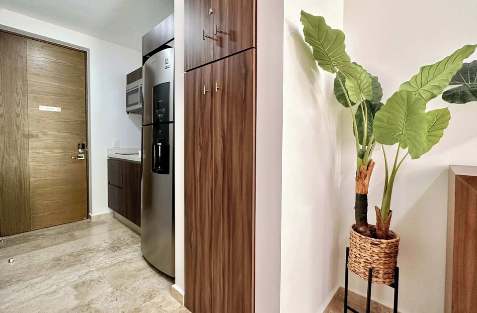 Handy kitchenette with fridge and ample storage for a comfortable self-catering stay