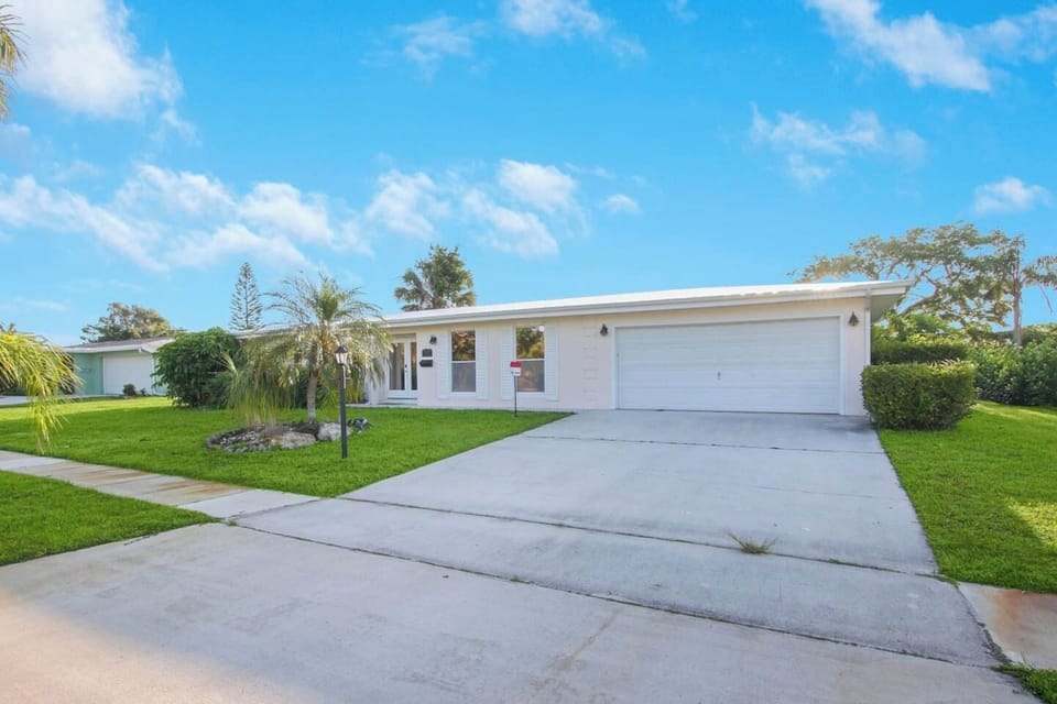 Beautiful blue bird skies are a regular here. This large driveway outside has free parking available for guests. There is space for 4 vehicles here. 