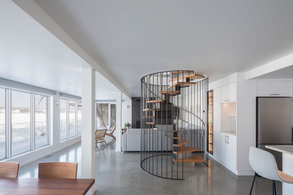 Cozy living room with architect-designed staircase.