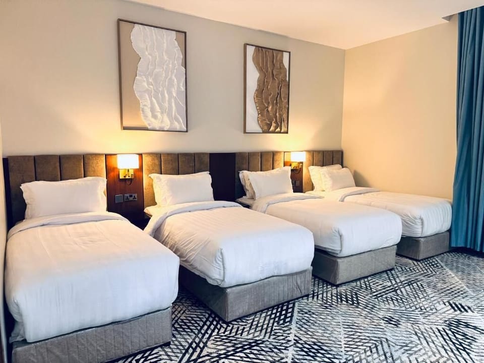 Deluxe Quadruple Room, City View | In-room safe, soundproofing, iron/ironing board, WiFi (free)