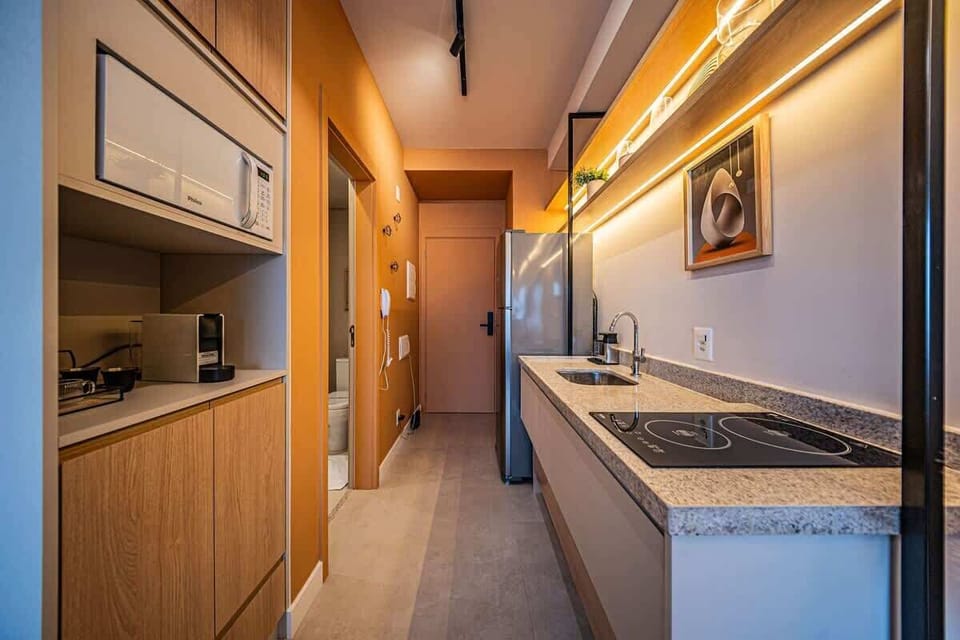 Deluxe Studio Suite, City View | Private kitchen | Fridge, microwave, stovetop, cookware/dishes/utensils