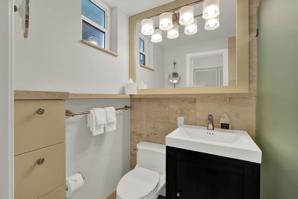 Deluxe Room, Pool View | Bathroom | Hair dryer, towels, soap, shampoo