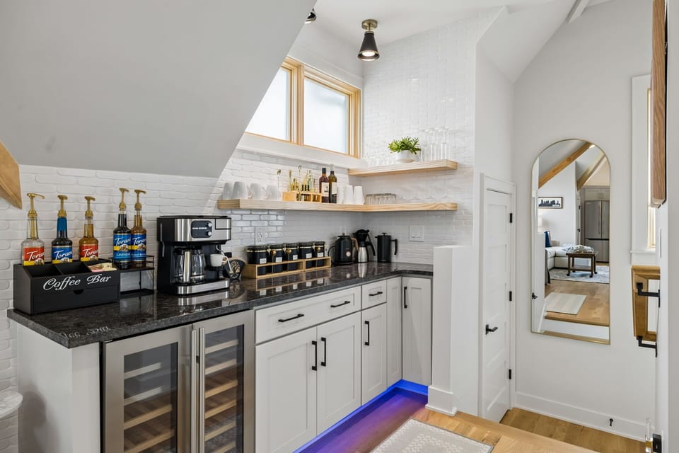 Coffee and Tea bar along with a wine fridge and barware