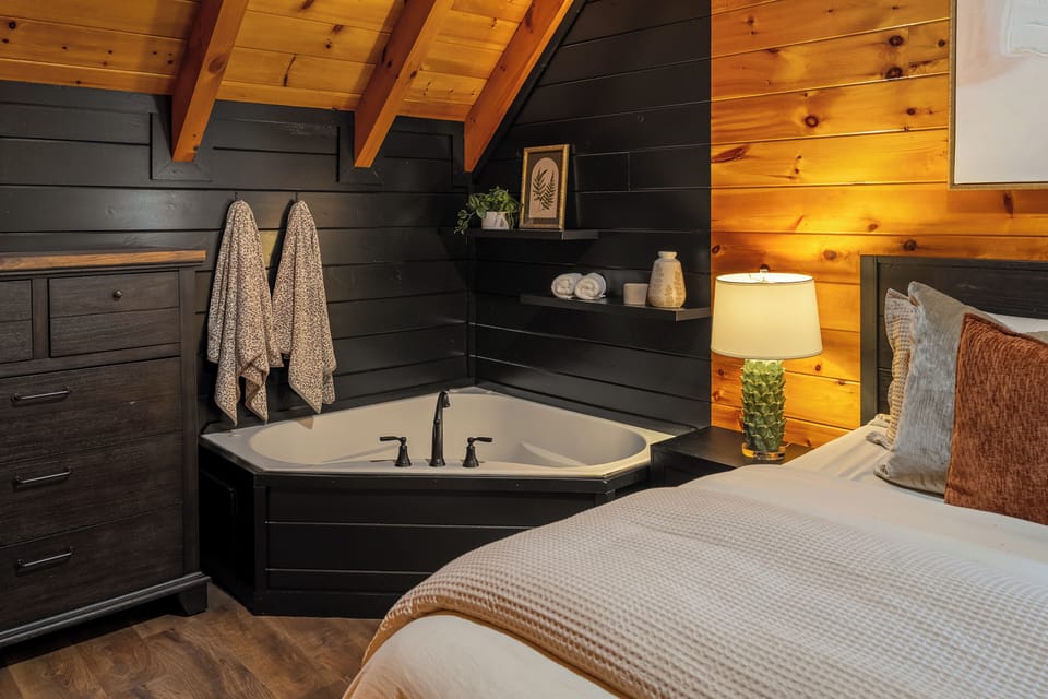Cozy king suite with an in-room tub creating honeymoon vibes. 