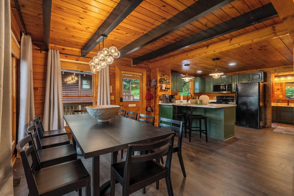 Cozy open-concept cabin dining and kitchen with rustic charm