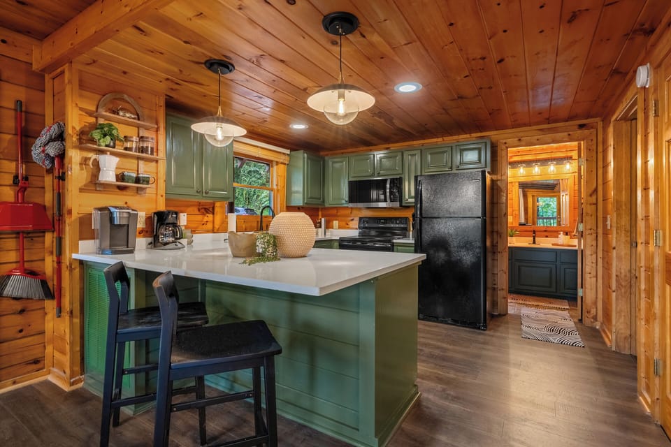 Cozy kitchen with island seating and everything you need to cook a family meal. 
