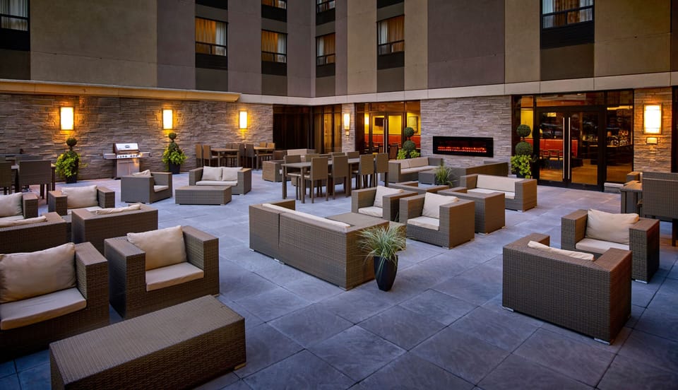 Lounge in comfort on the patio, surrounded by cozy seating and inviting ambiance.
