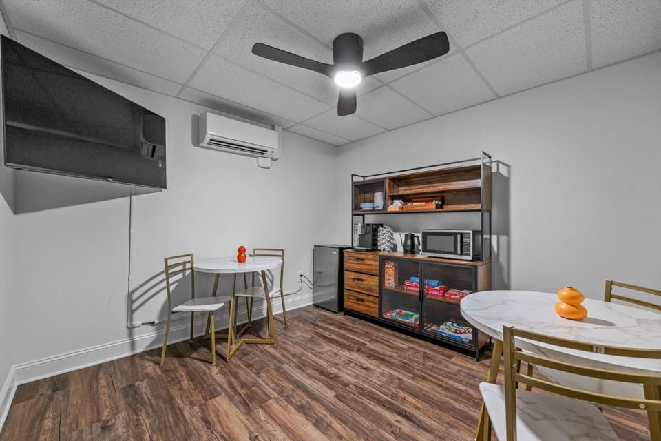 Shared Community Lounge with Seating, Tables, a Smart TV, Board games, and a Refreshment Station.
