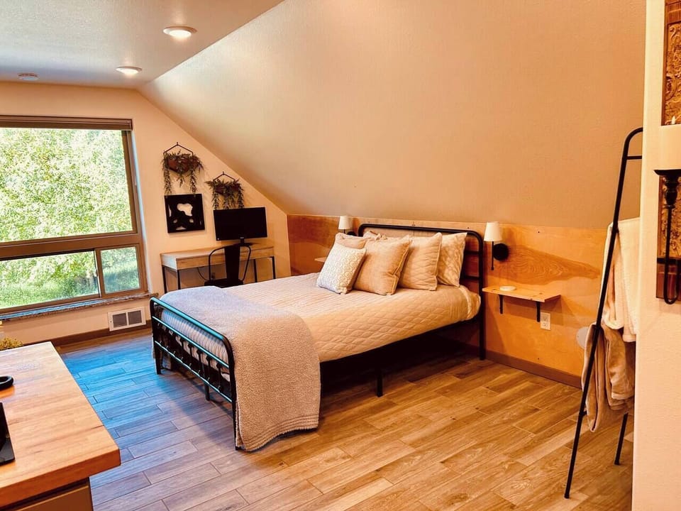 This is a studio space. Sleeping area is a shared area between the queen bed, living room twin sofa couch and an extra twin blow up mattress if needed. 