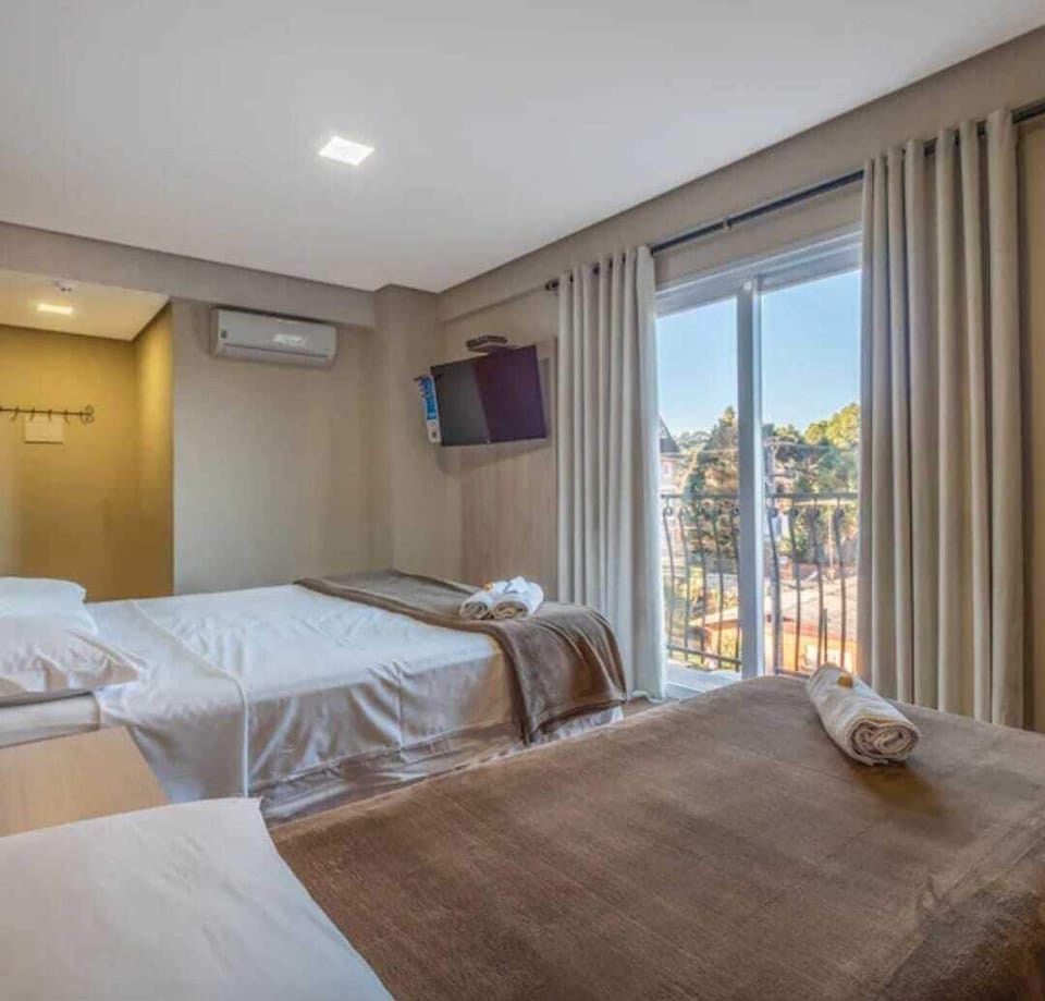 Double Room, Balcony, City View | Blackout drapes, iron/ironing board (on request), WiFi (free)