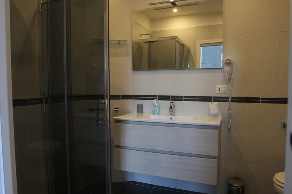 Junior Suite, 1 Double Bed with Sofa bed, Ensuite, Partial Sea View | Bathroom | Shower, free toiletries, hair dryer, slippers