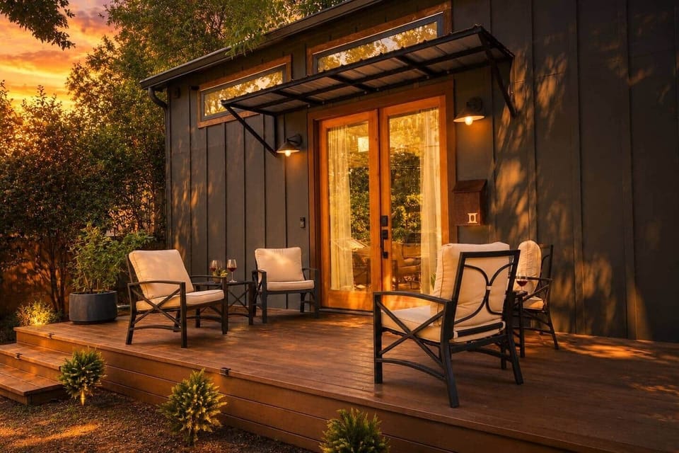 Modern tiny home with a private deck tucked beneath mature oak trees, creating a peaceful retreat just minutes from Downtown Austin.
