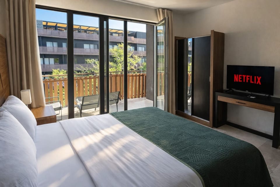 Deluxe Apartment, Balcony, Courtyard View | Blackout drapes, iron/ironing board, WiFi (free)