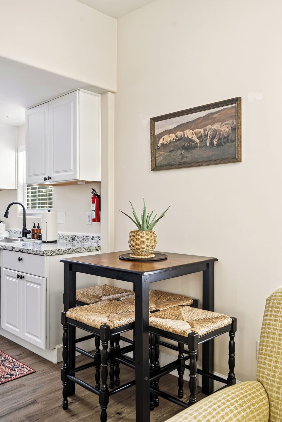 Cozy breakfast nook beside a bright, stylish kitchen
