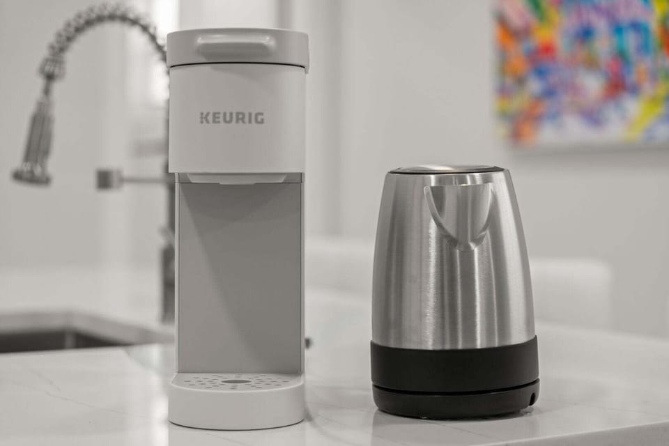 Keurig coffeemaker and electric kettle stocked in the kitchen