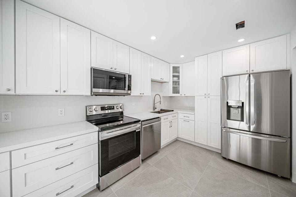 Fully stocked kitchen with cookware and utensils