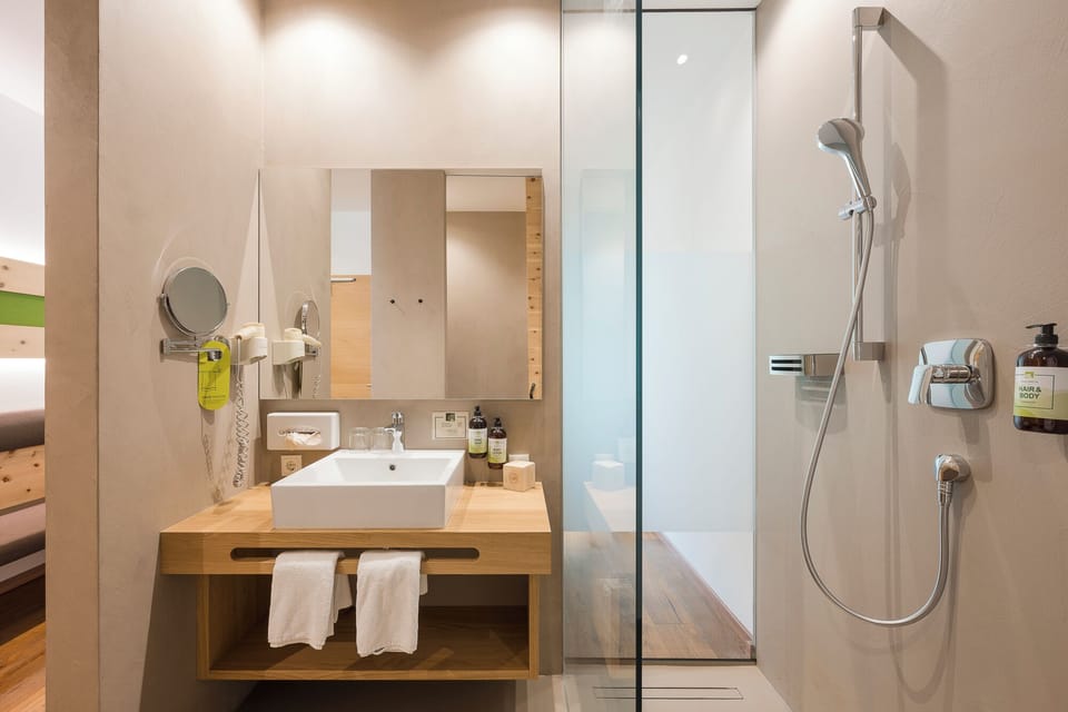 Superior Double Room | Bathroom | Eco-friendly toiletries, hair dryer, bathrobes, slippers