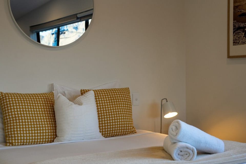 Cosy bedroom with stylish décor and bedside lighting