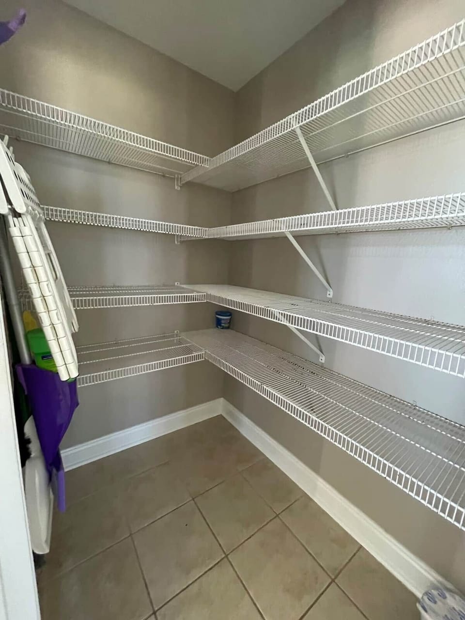 This is the large pantry attached to the kitchen.  We have provided a few cleaning supplies as well as such as a broom to help families keep the space tidy.  