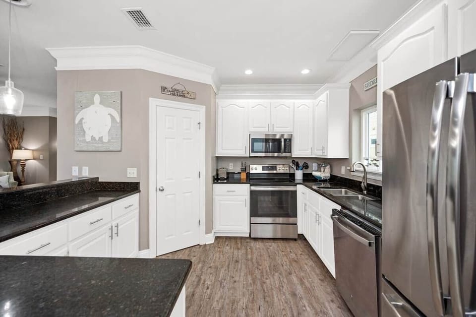 Kitchen has a large walk in pantry to accommodate large families.  We also have two refrigerators as well.  The second refrigerator is on the ground floor so you can store any beverages you will take to the beach.  