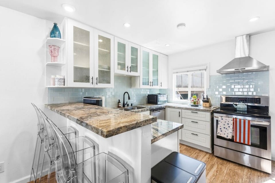 The heart of the home. Features sleek stainless steel appliances, crisp white cabinetry, and plenty of counter space. ✨🍽️