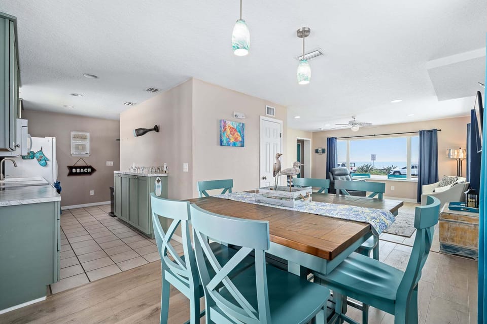 The dining area sits right next to the living room and offers seating for up to eight guests.