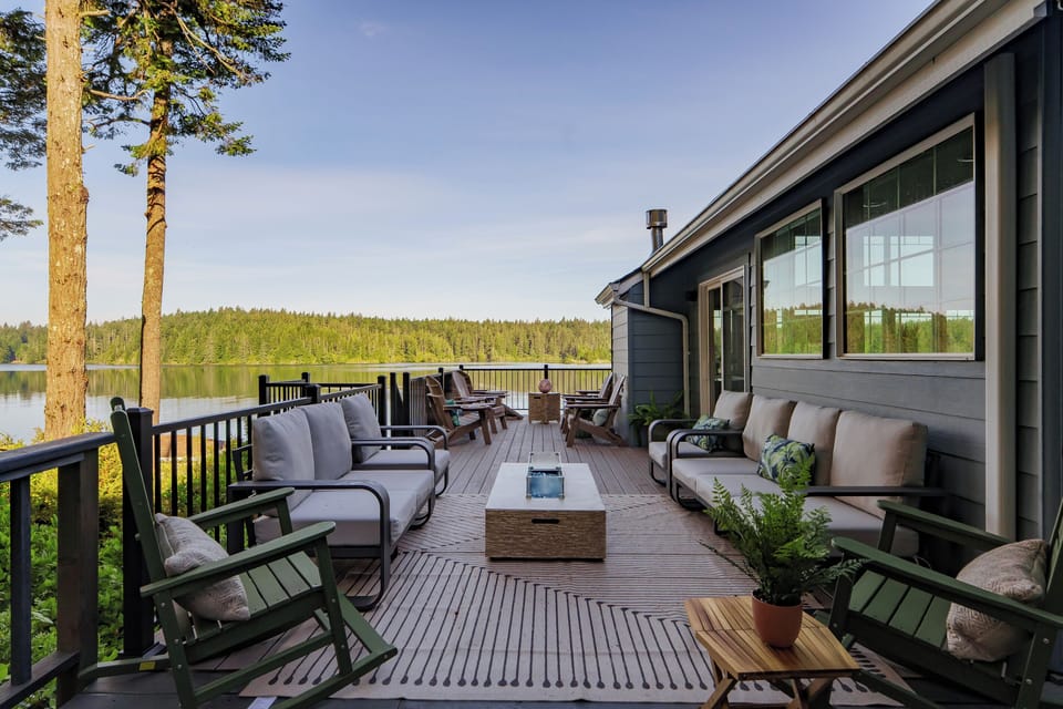 Spacious deck seating gives the entire group room to relax, reconnect, and take in the peaceful views of Woahink Lake together.