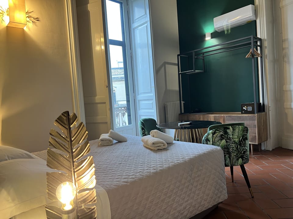 Deluxe Quadruple Room | Premium bedding, minibar, in-room safe, desk