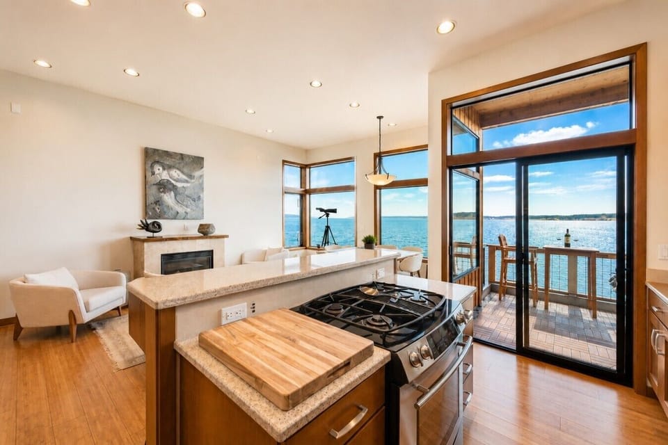 Kitchen & Dining: Spectacular water views from a modern space designed for culinary adventures!