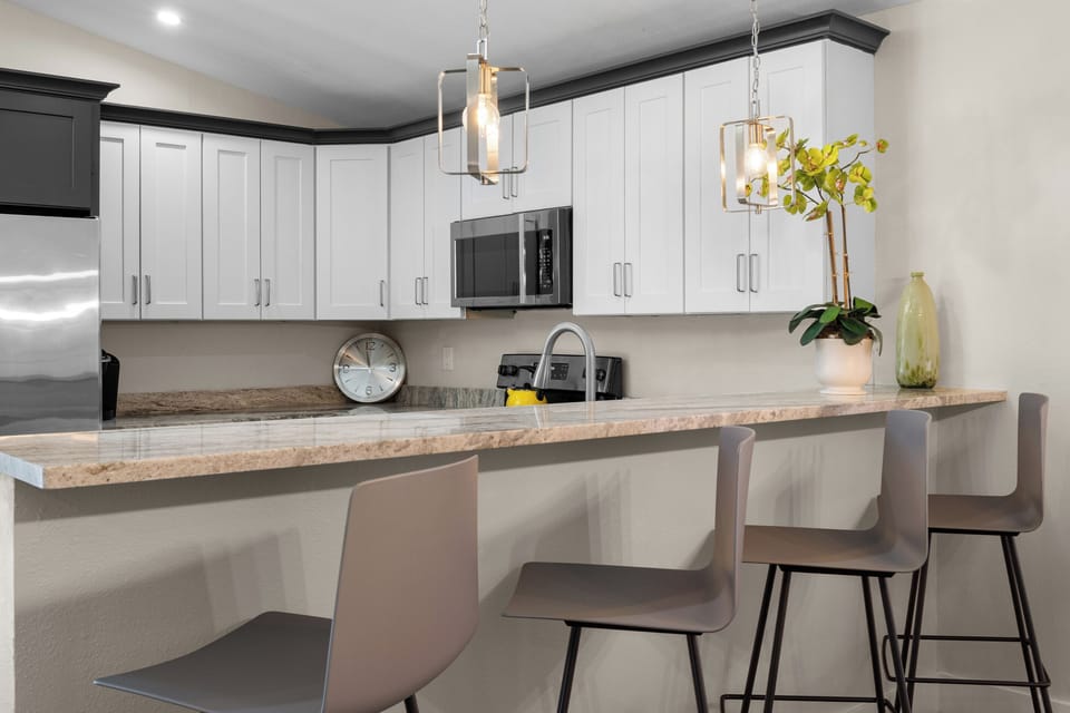Four kitchen stools at the breakfast bar.