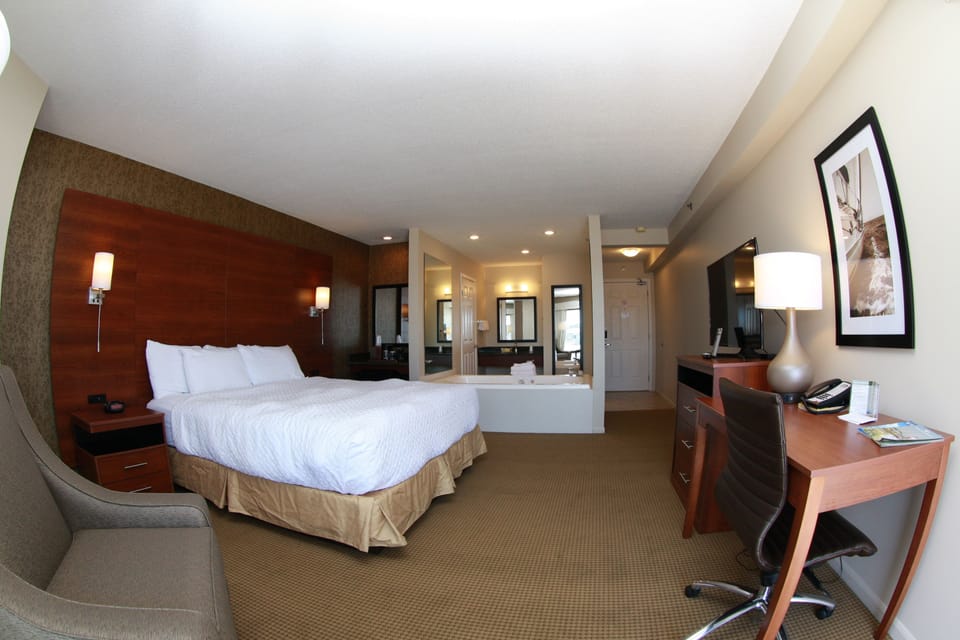 Deluxe Room, 1 King Bed, Jetted Tub | Desk, laptop workspace, iron/ironing board, free cribs/infant beds