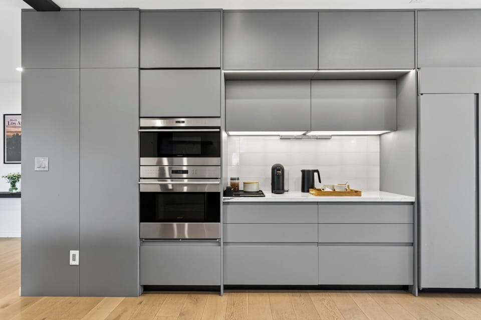 Sleek gray cabinetry paired with premium stainless finishes.