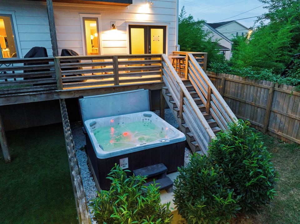 Private hot tub tucked below the back deck, perfect for unwinding after a day out.