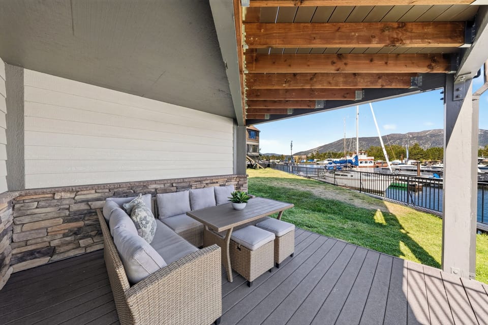 Covered patio with lounge seating and front-row marina views.
