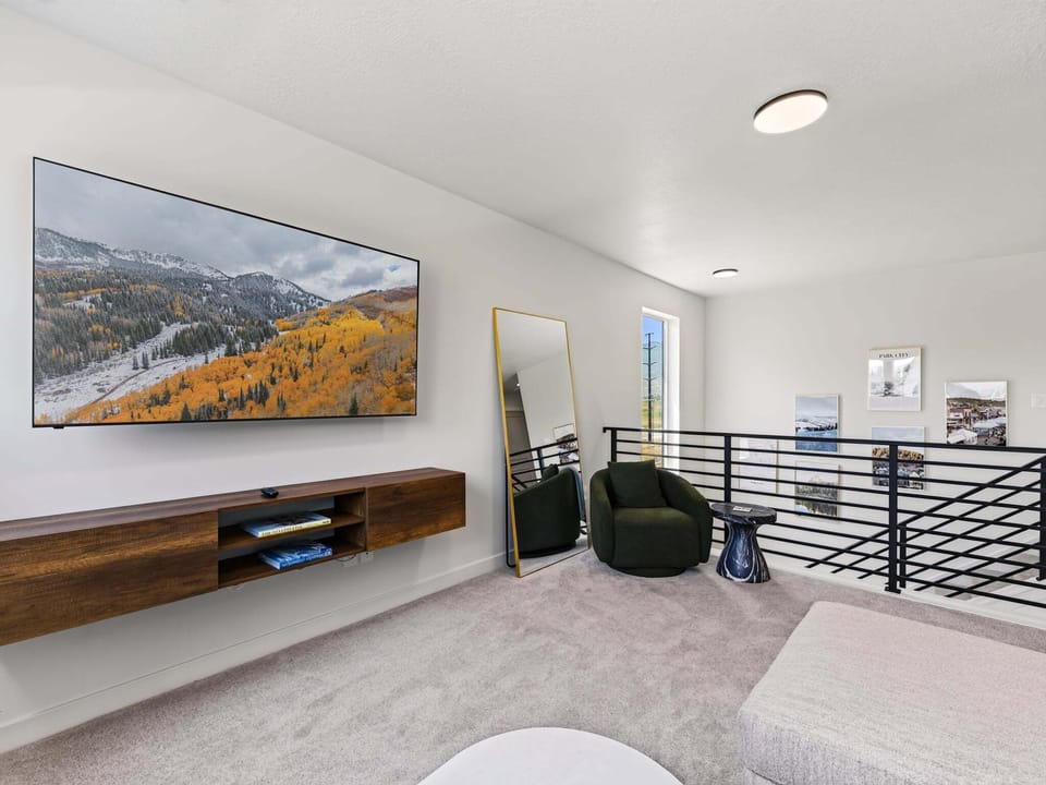 A 75" Smart TV and Sofa bed couch in the upstairs Loft
